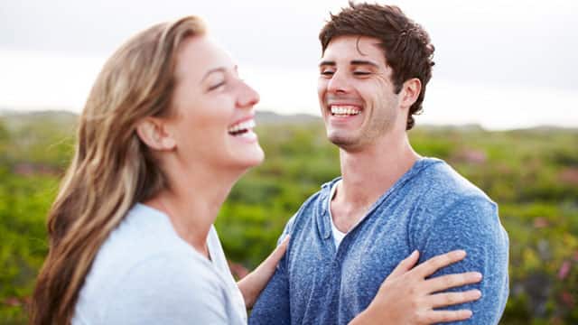 A woman and a man embraced outdoors A woman and a man embraced outdoors