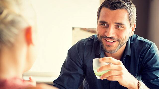 A man drinking an acidic drink A man drinking an acidic drink