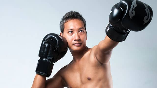 Young man doing boxing exercise