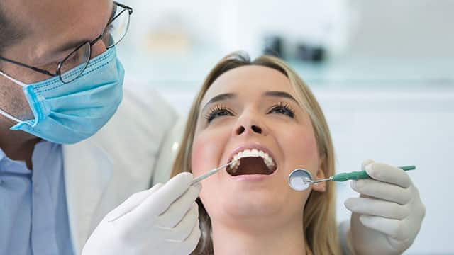 Dentist checking a patient