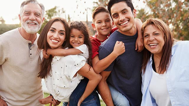 Big family smiling outside Big family smiling outside