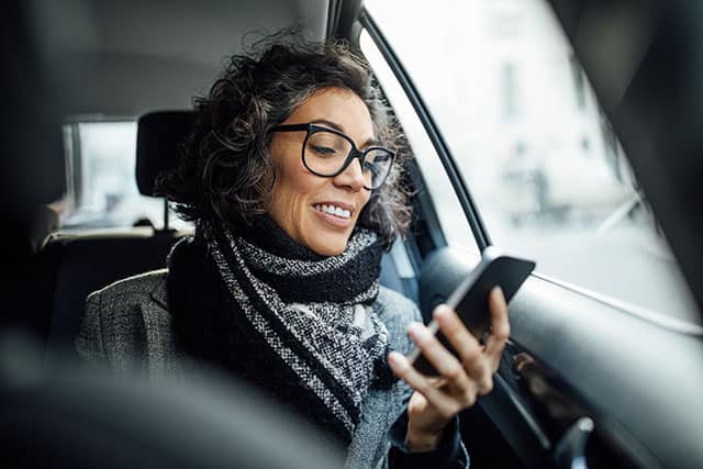 Woman is looking at a smartphone