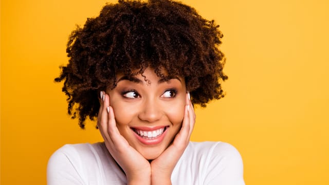 A portrait of a smiling young woman