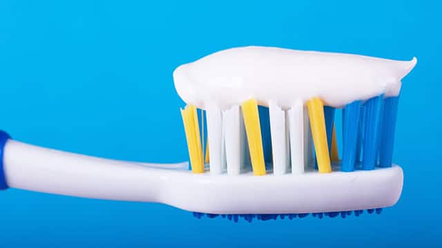 A close up of toothpaste on a toothbrush
