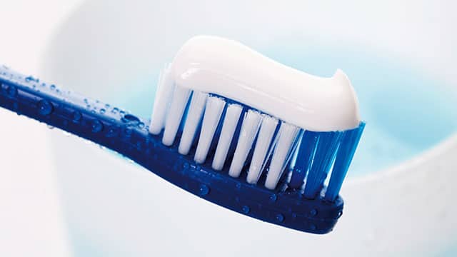 A close up of a toothpaste on a toothbrush
