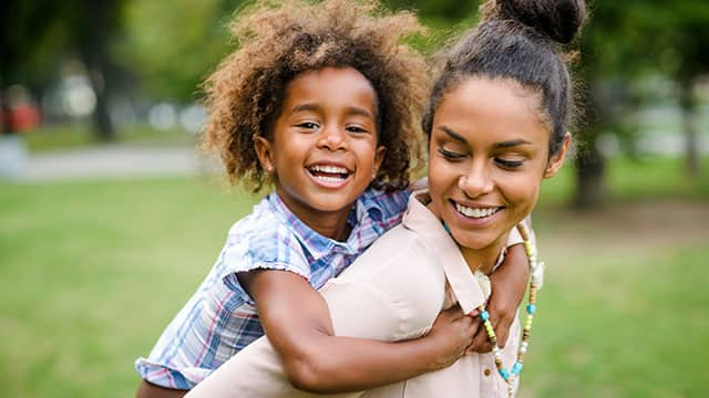 mother and daughter playing in the park