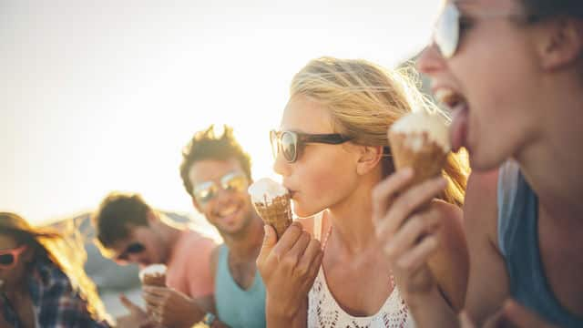 a group of friends enjoying ice cream cone