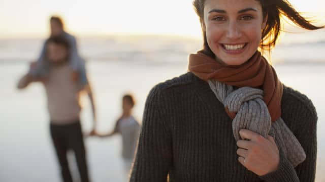 Woman smiling and sharing with her family