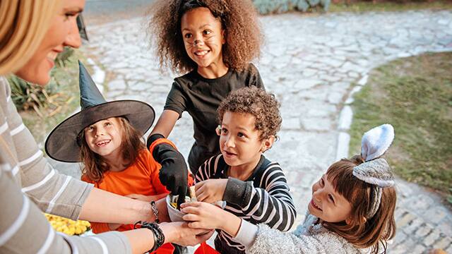 Children in Halloween costumes, trick or treating