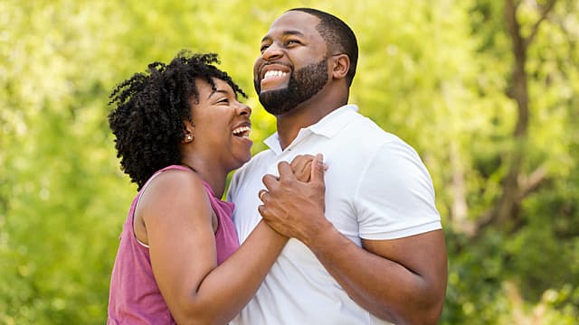 Happy African American couple laughing and smiling.