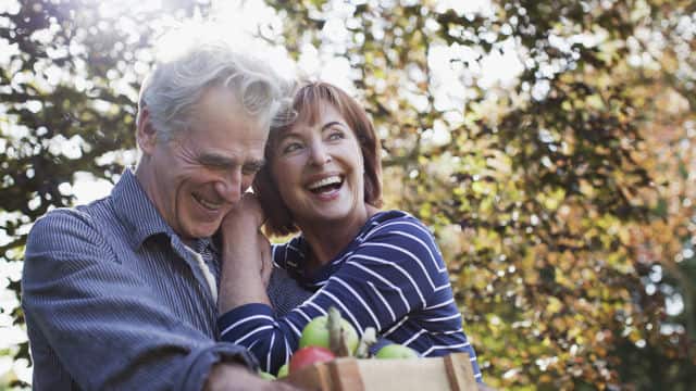 Senior couple laughing and enjoying outdoors