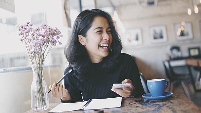 Asian woman in coffee shop cafe