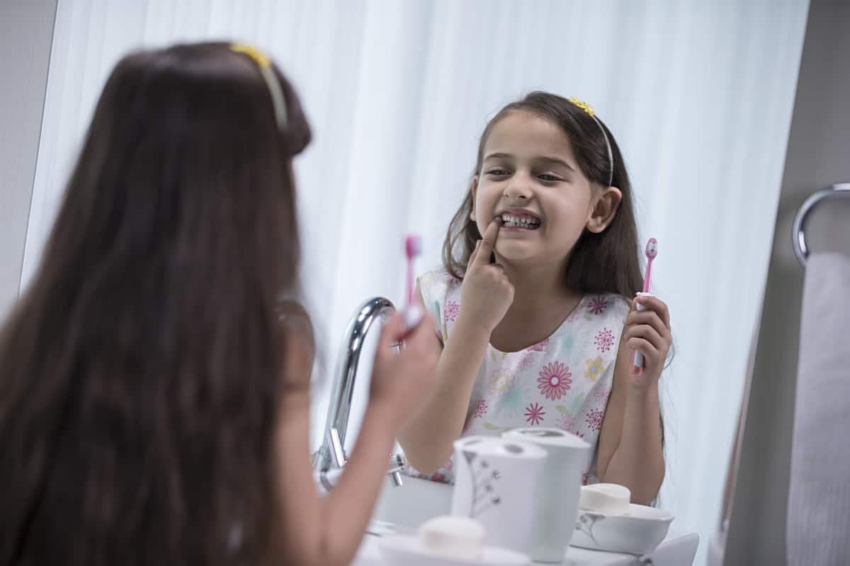 Girl brushing her teeth