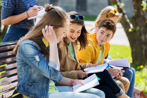 students are reading on prognathism treatment together outdoors