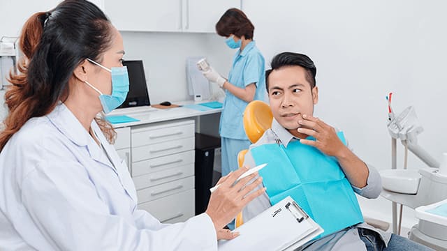 Dentist professional explaining treatments to her patient
