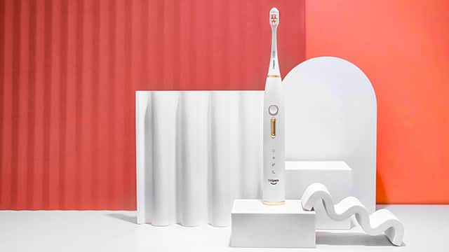 Electric Toothbrush on orange background