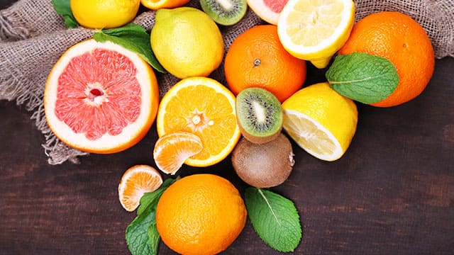 High acidic fruits with their green leaves