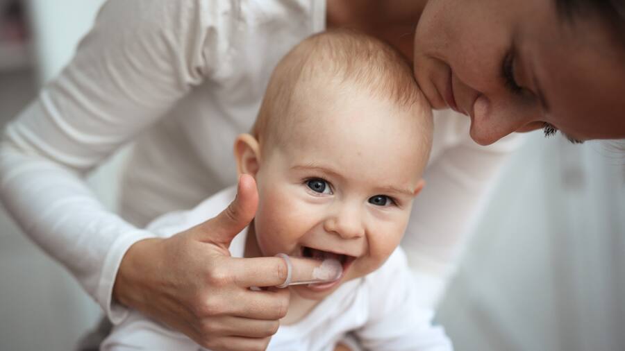 Brushing babies sales first teeth