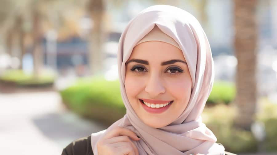 smiling-girl-hijab-covering-her-eyes