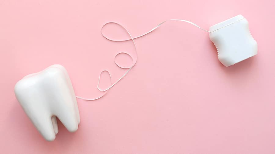 differences between waxed and unwaxed dental floss - colgate in