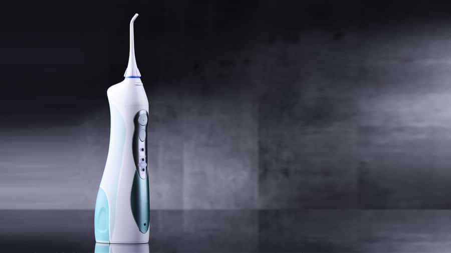 types and benefits of an electric flosser - colgate in