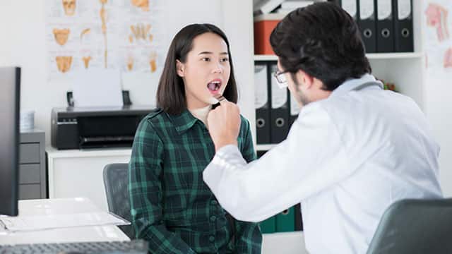 A young lady seeking medical assistance for cold sore