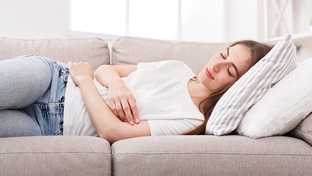 Relaxed girl taking nap at home