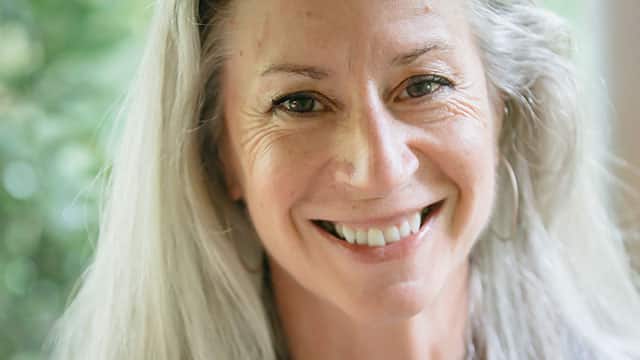 A portrait of the middle age woman smiling