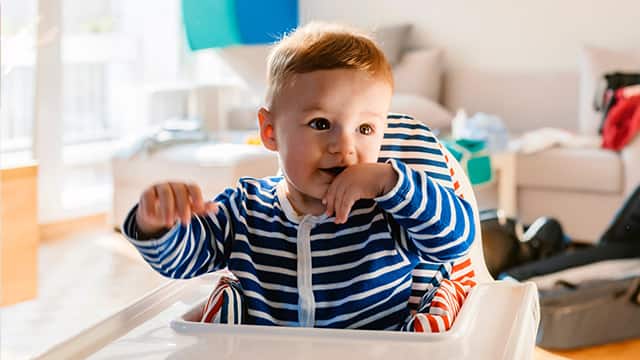 Young Boy In High Chair Young Boy In High Chair