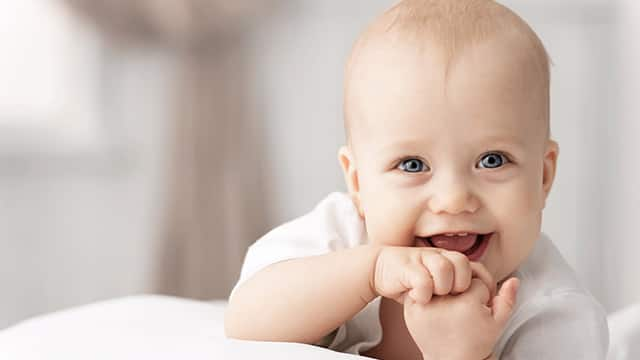 smiling toddler with blue eyes