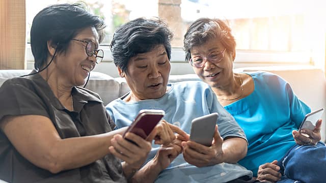 Older women looking at their phones