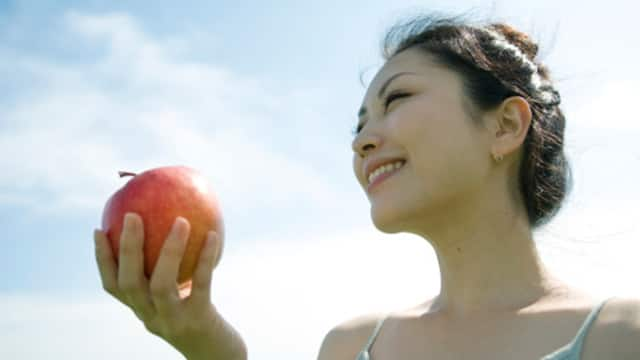 young lady eating apple