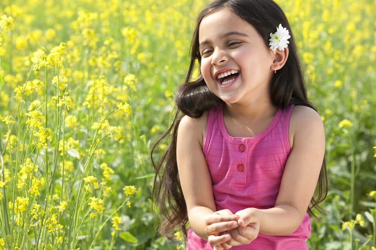 Girl smiling and playing outside