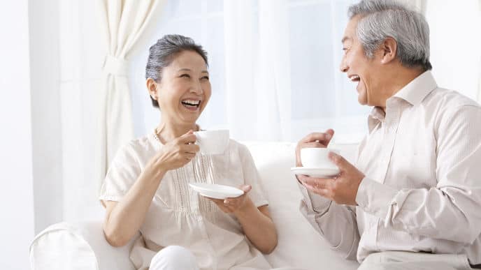 couple smiling showing teeth