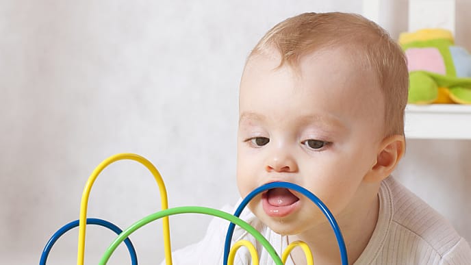 Baby having fun with a toy