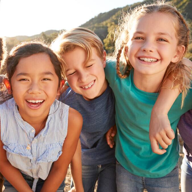 Three kids smiling Three kids smiling
