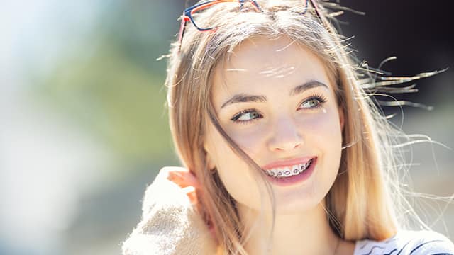 young woman smiling with braces