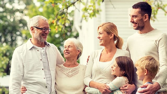 Large family outside their home