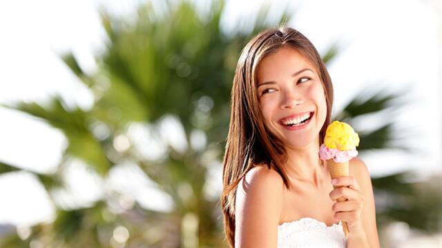 woman smiling eating ice cream