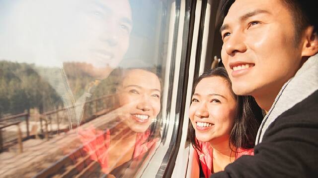 couple looking outside of train window