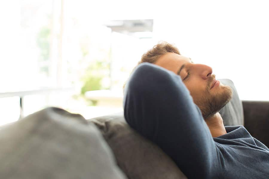 Couple Rests at Home While Recovering From a Tooth Extraction