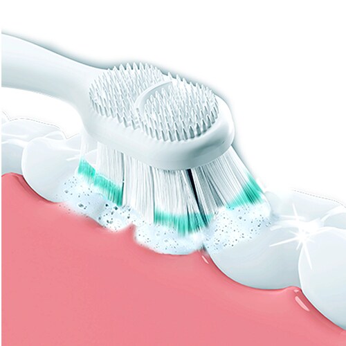 Toothbrush foaming up as it brushes teeth