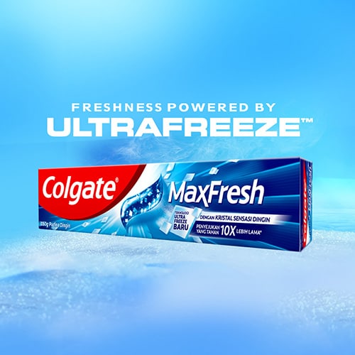 Colgate MaxFresh Toothpaste against a blue icy backdrop