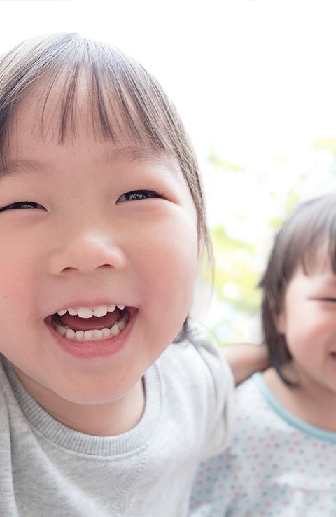 Smiling girls playing Smiling girls playing