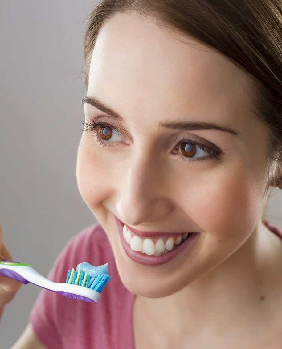 woman brushing teeth
